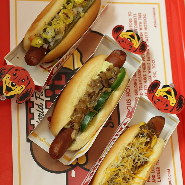 "Three different kinds of hot dogs in a tray at Tail O’ The Pup."
