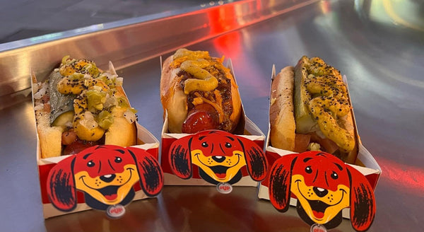 Local favorite hot dogs in Los Angeles at Tail O' The Pup, served in iconic pup-shaped trays.